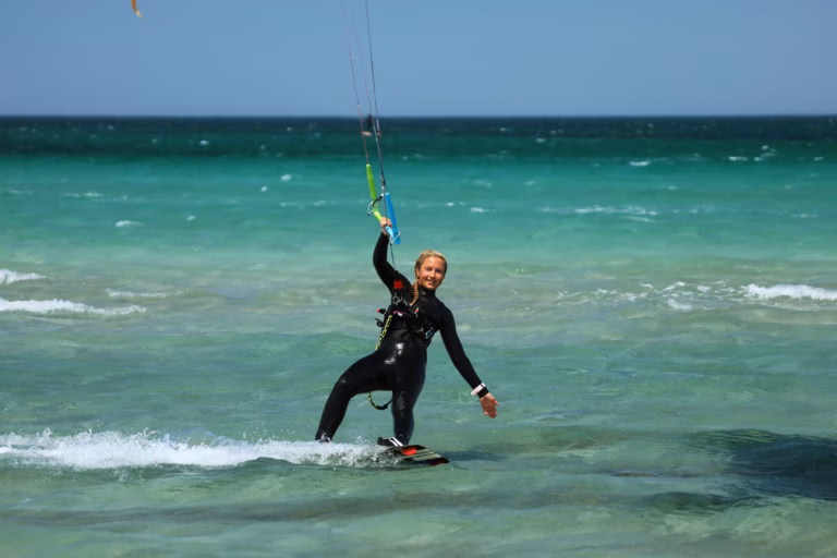 A woman kitesurfing.